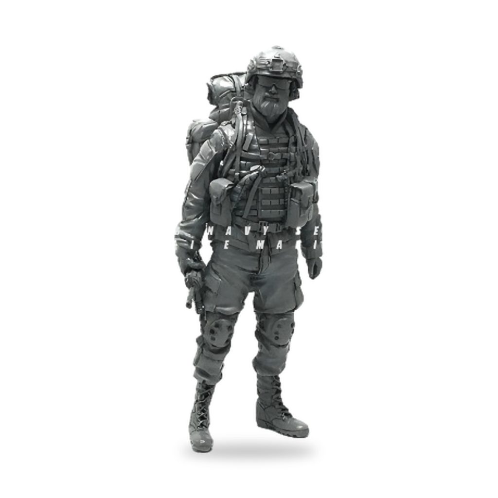 Unpainted US Army soldier figure in tactical gear with backpack and helmet.