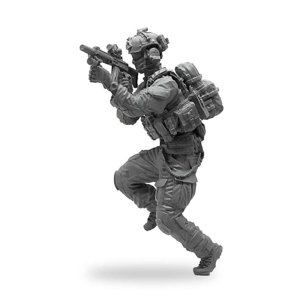 Unpainted US Army Delta Force soldier in tactical gear holding rifle.