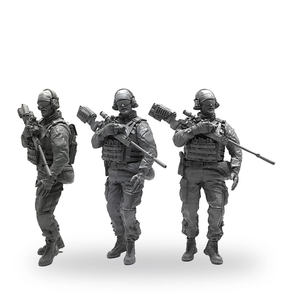 Three detailed US Army Navy SEAL sniper figures in tactical gear holding rifles.