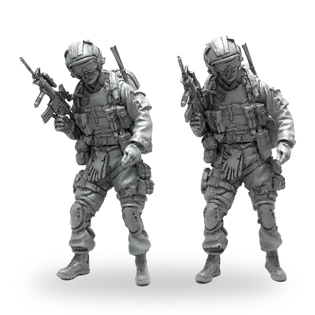 Unpainted US Special Forces soldier figure in tactical gear holding rifle.