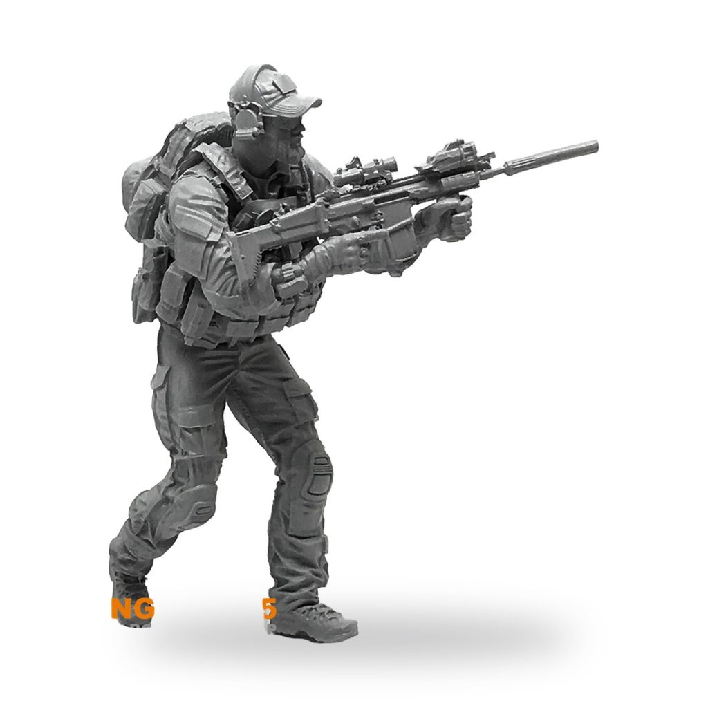 Unpainted 1/35 scale US Delta Force soldier holding rifle in tactical stance.