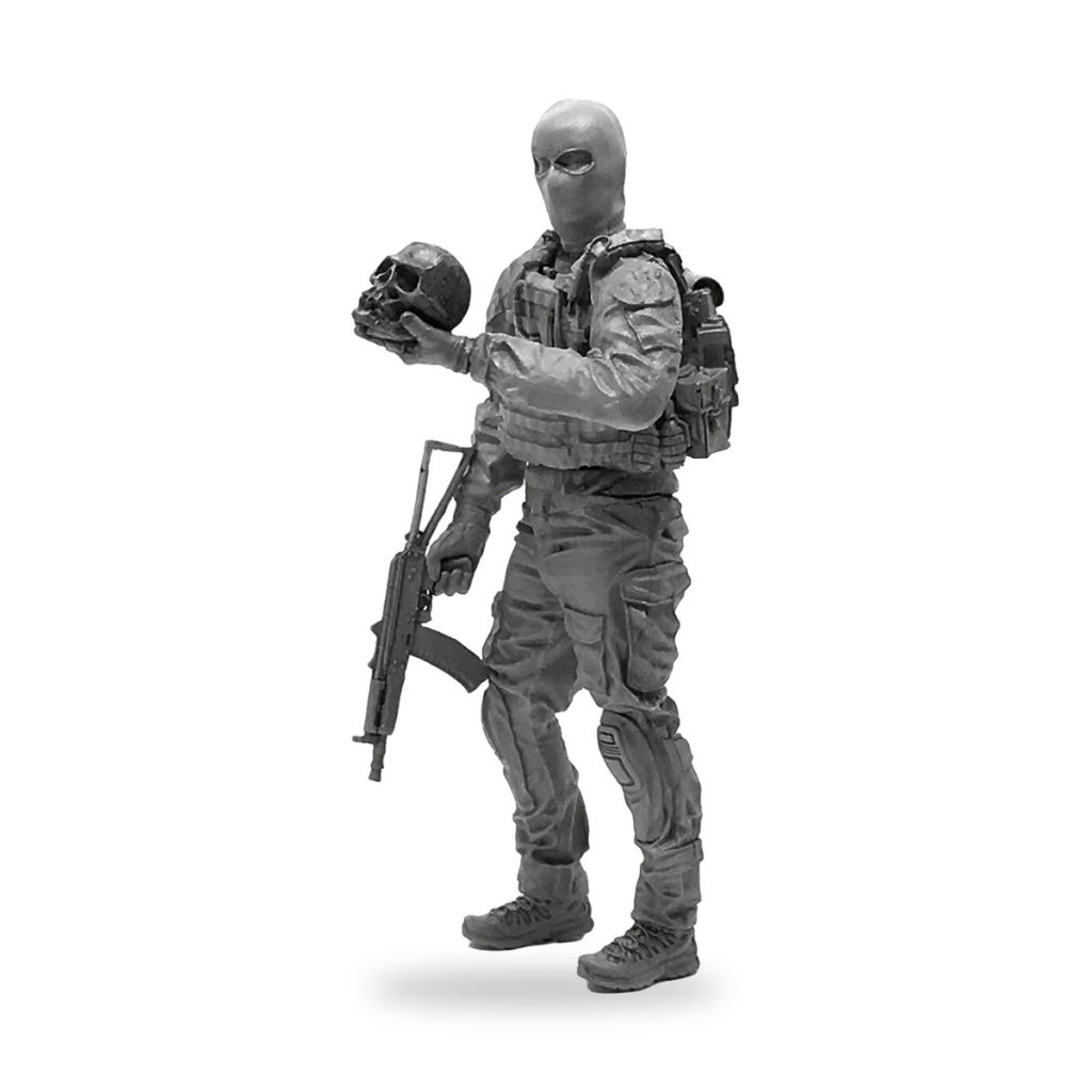 Unpainted 1/35 scale mercenary soldier figure holding skull and rifle.