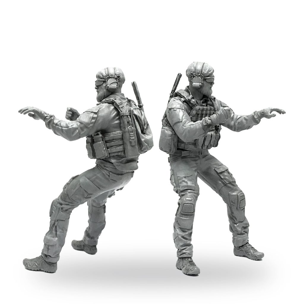 Unpainted US soldier figure in tactical gear with backpack and rifle.