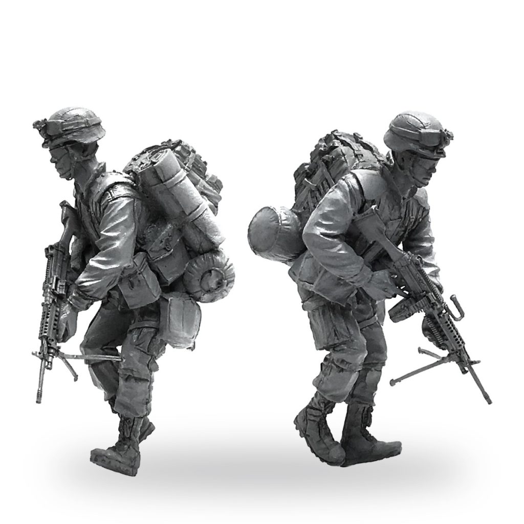 Unpainted US Marine soldier with rifle and gear in walking pose.