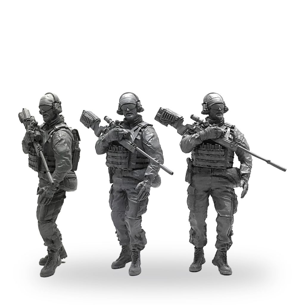Three US Navy SEAL soldier figures in tactical gear with rifles.
