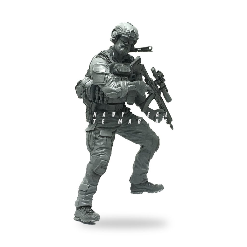 Unpainted US Navy SEAL special ops soldier figure in combat gear holding rifle.
