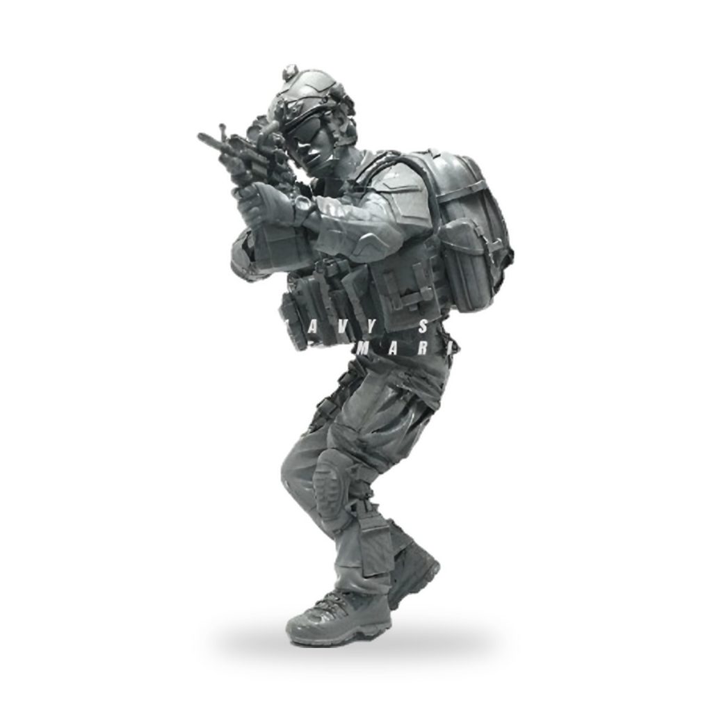 Unpainted US Navy SEAL figure in tactical gear holding M4A1 carbine rifle.