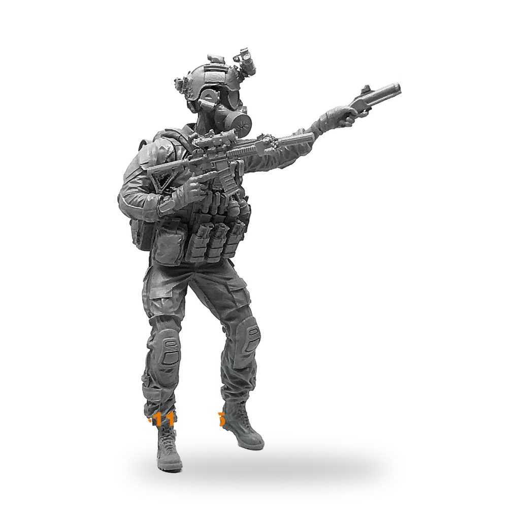 Unpainted 1/35 US Marine Special Forces soldier figure with combat mask and weapons.