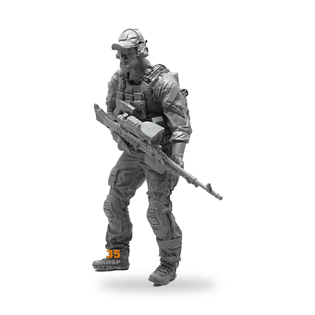 Unpainted US Navy SEAL soldier figure with assault rifle and tactical gear.