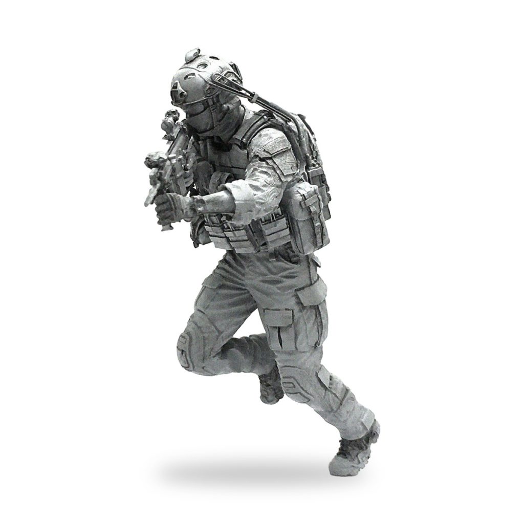 Unpainted US Marine soldier in tactical gear holding rifle.