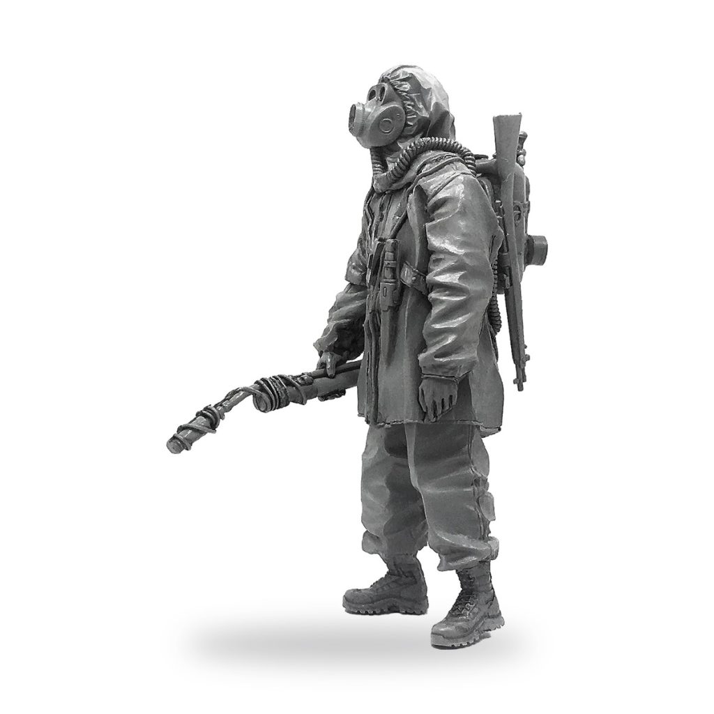 Unpainted US Army soldier with flamethrower and gas mask in Vietnam War gear.