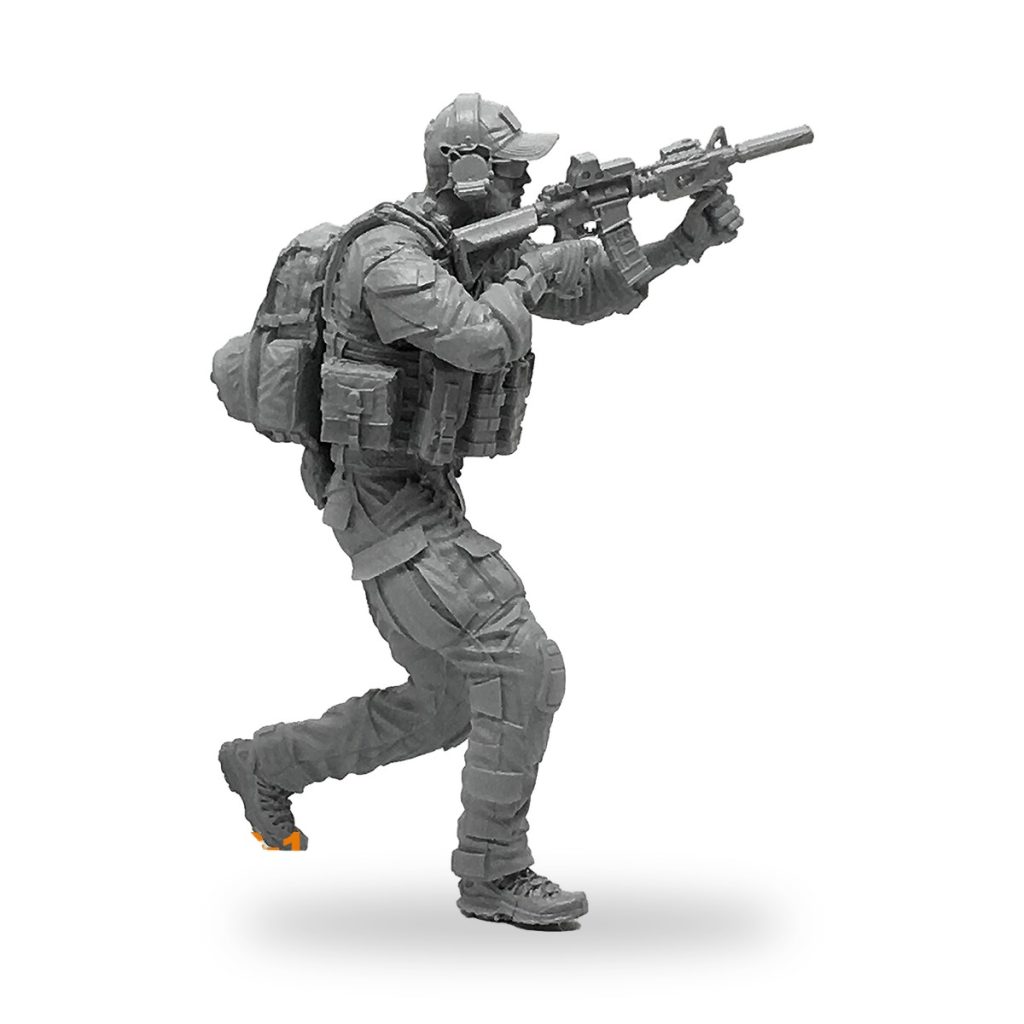 Unpainted US Navy SEAL soldier figure in tactical gear holding assault rifle.