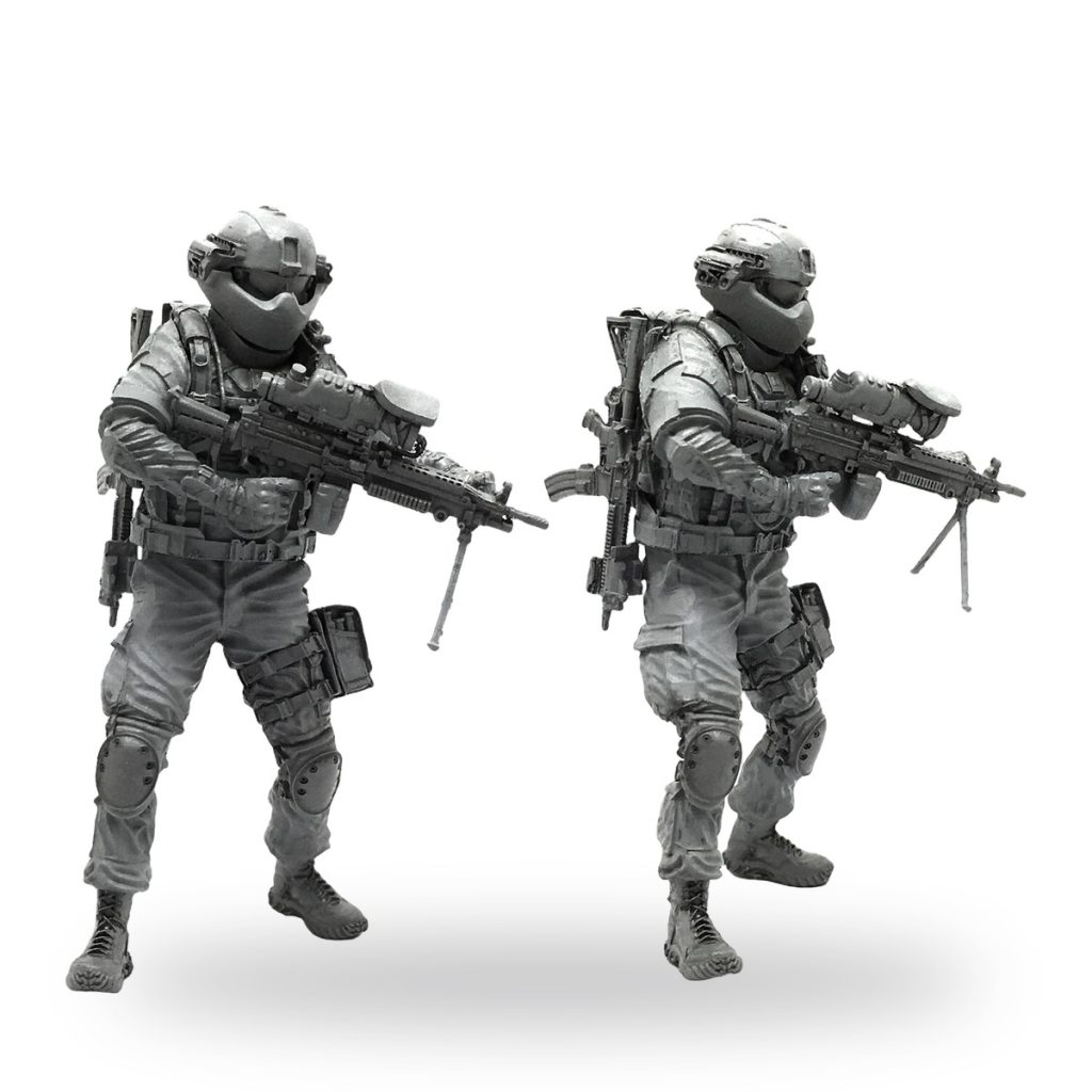 Unpainted US Marine Corps soldier with light machine gun in combat gear.