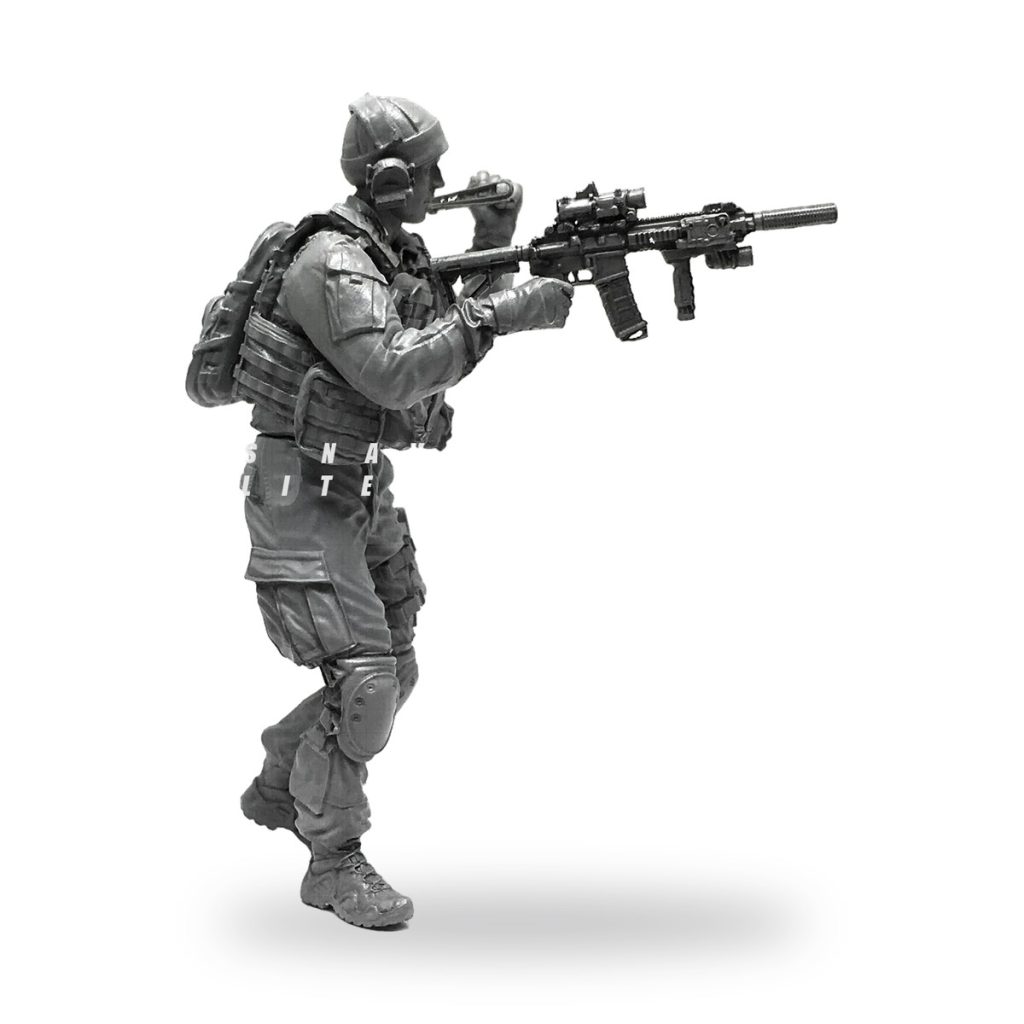 Unpainted US Special Forces Captain figure in tactical gear holding rifle.