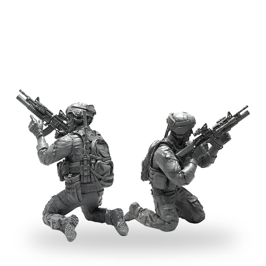 Unpainted US Navy SEAL special ops commando rifle figure models in combat poses.