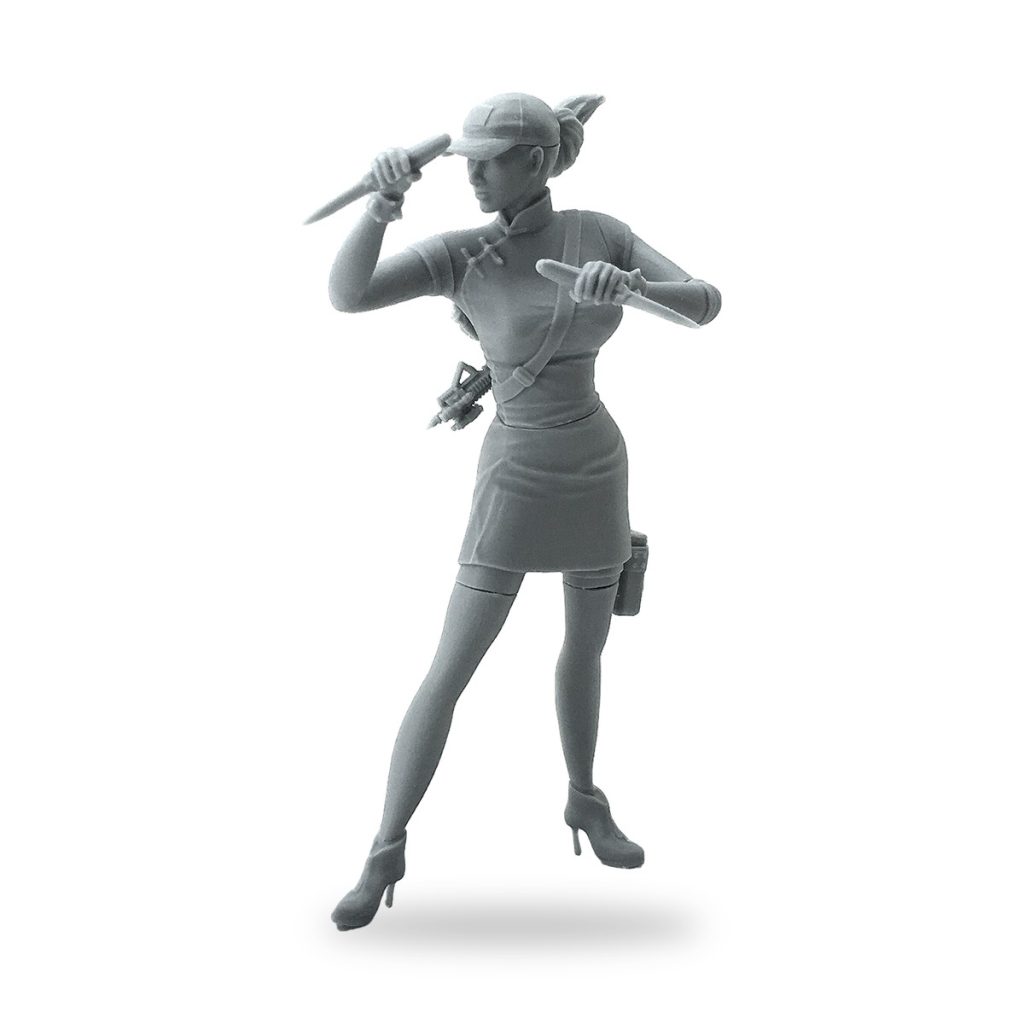 Unpainted female secret agent figure holding knives in dynamic pose.