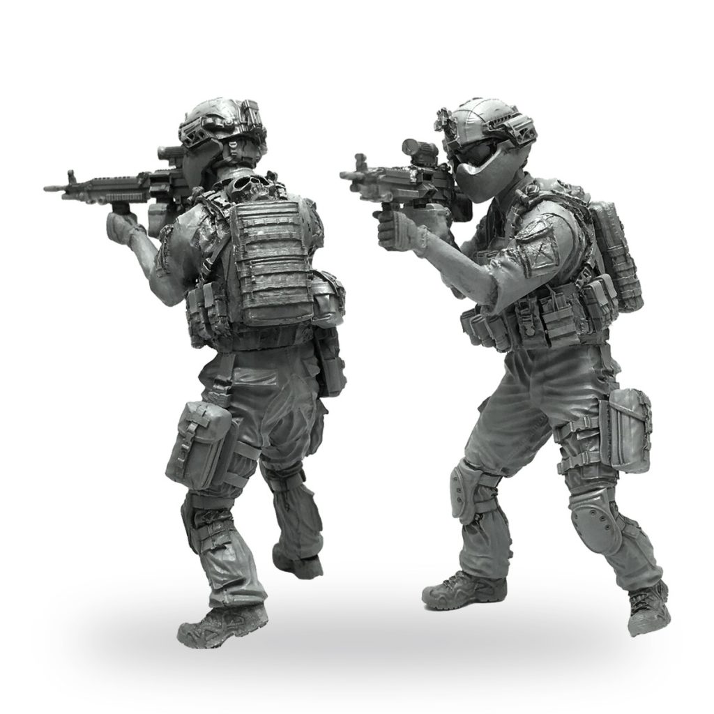Unpainted 1/35 scale special forces soldier miniature in tactical gear holding rifle.