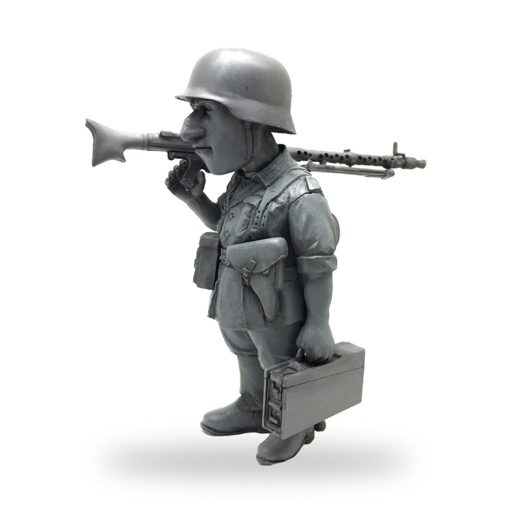Unpainted WW2 German soldier figure with machine gun and briefcase.