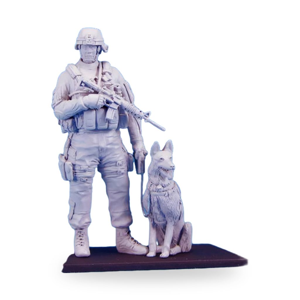 Unpainted US soldier and K9 dog handler miniature figure on base.