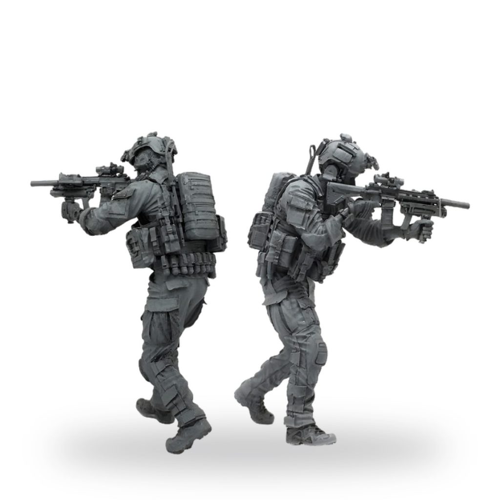 Unpainted US Elite Special Forces soldier figures in tactical gear with rifles.
