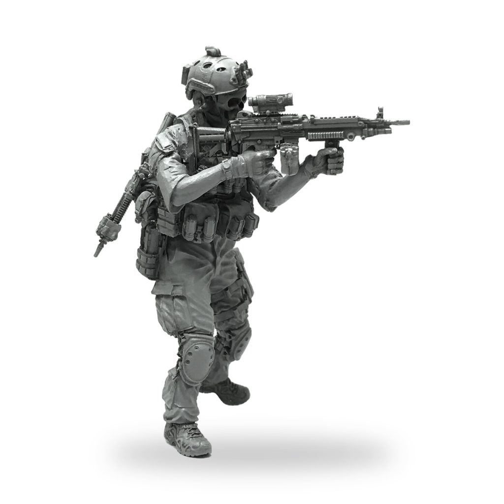Unpainted 1/35 scale special forces soldier miniature with rifle and gear.