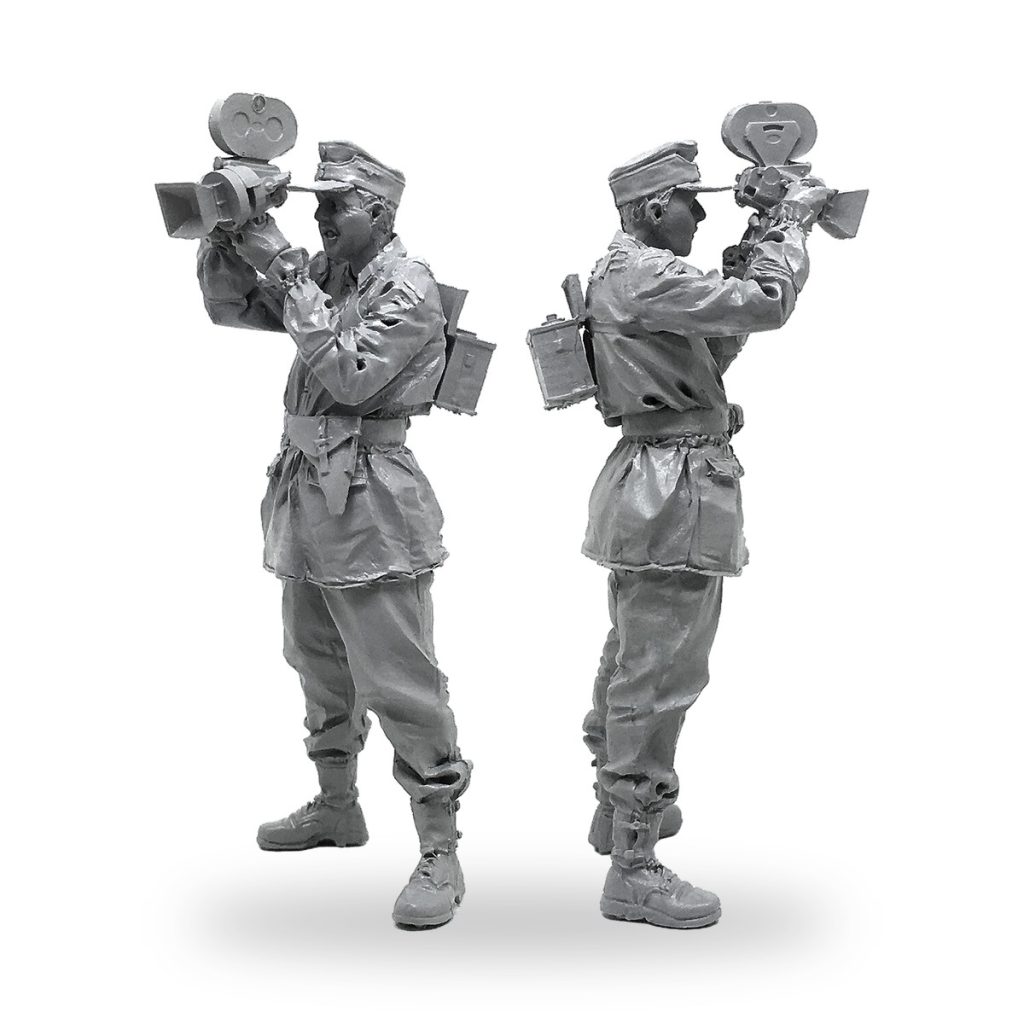 Unpainted 1/35 scale soldier holding vintage camera in two views.