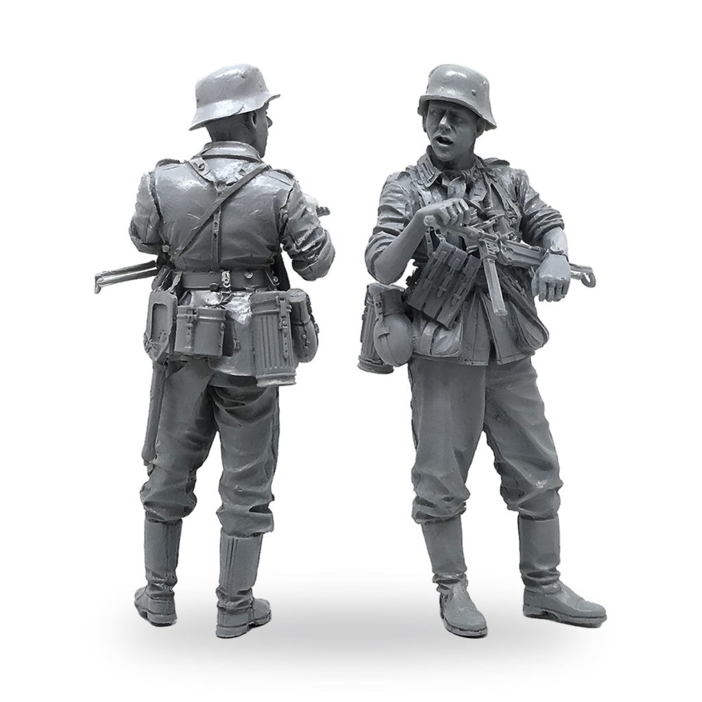 Unpainted WWII German soldier figures in uniform with gear and weapons.
