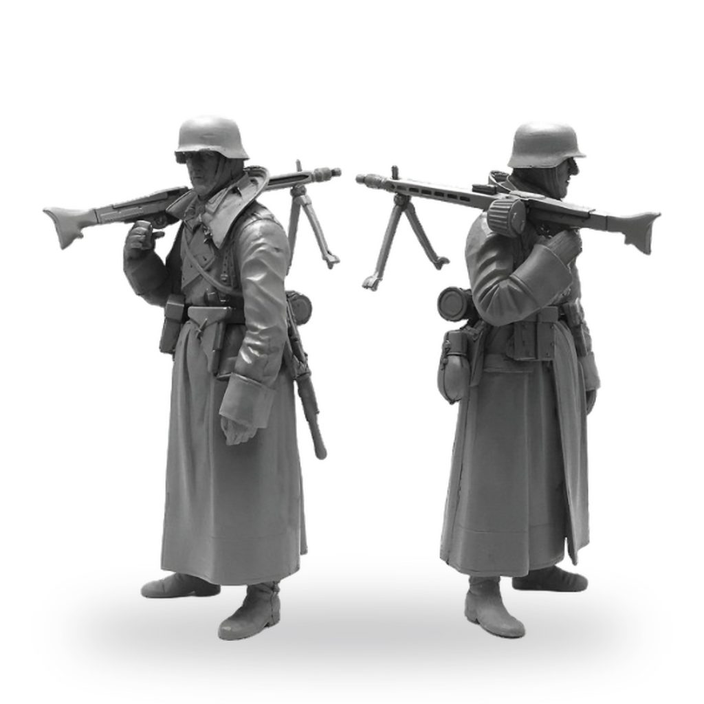 Unpainted German WWI machine gunner miniature in trench coat and helmet.