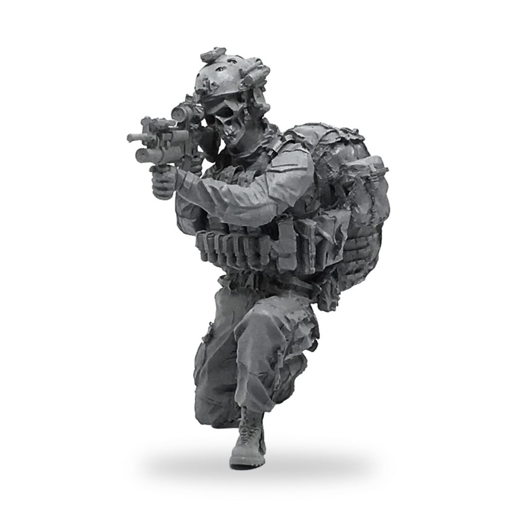 Unpainted modern soldier miniature with skull mask and tactical gear.