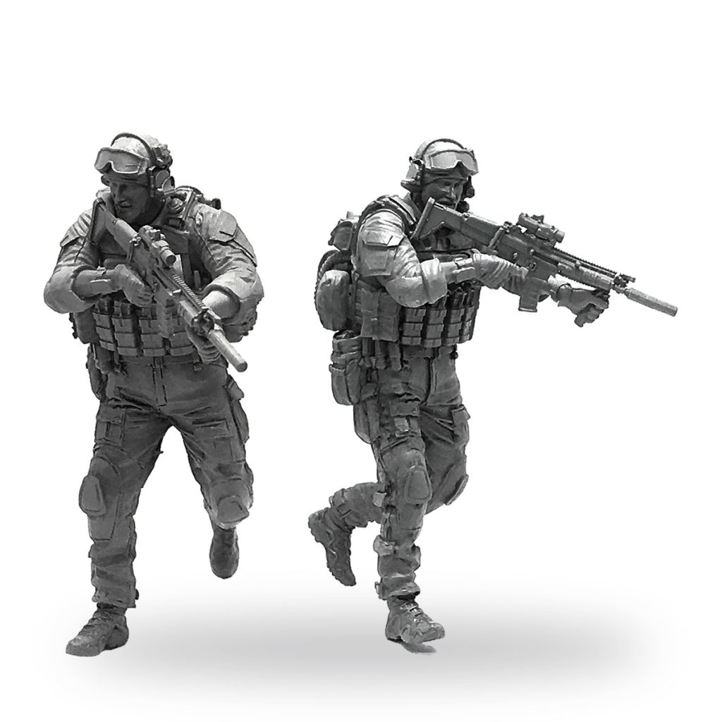 Unpainted 1/35 scale modern American soldier miniature in tactical gear with rifle.