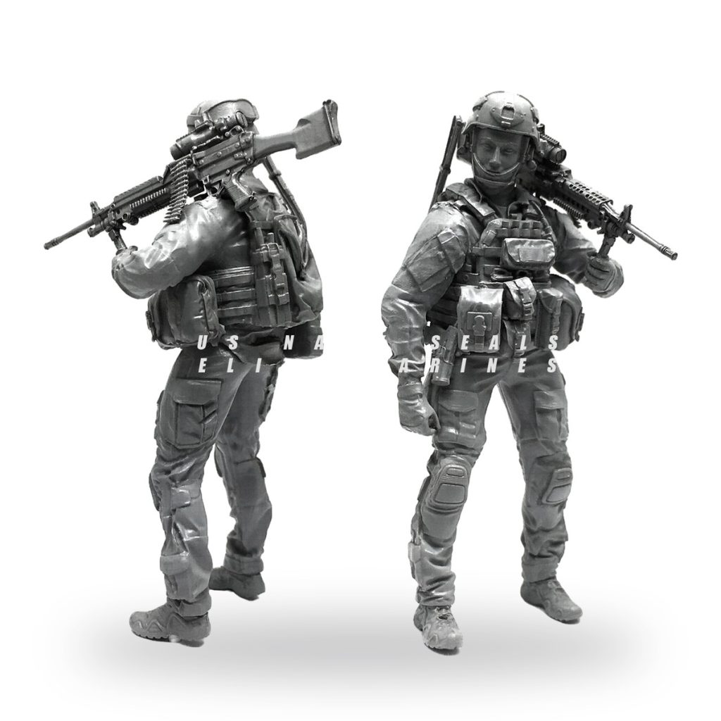 Unpainted 1/35 scale modern soldier miniature with rifle and tactical gear.