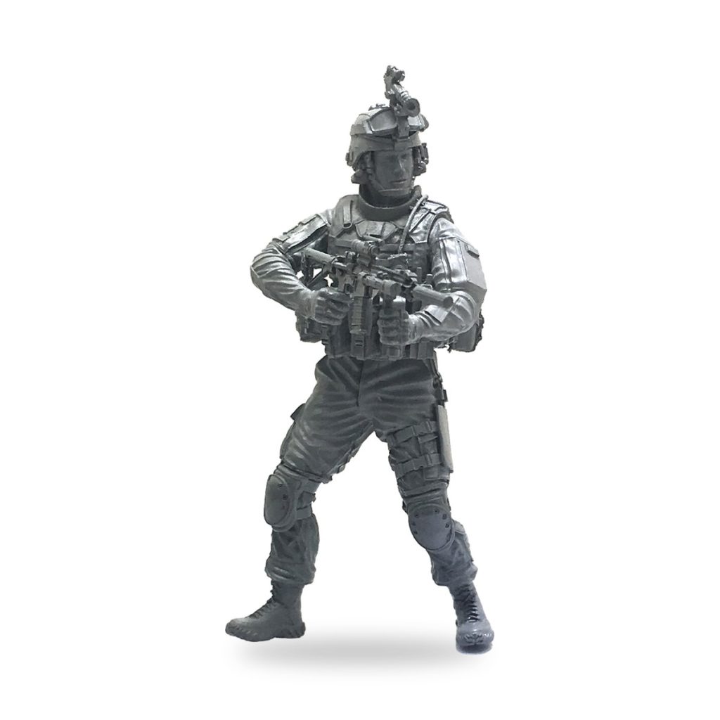 Unpainted US Army Special Forces soldier in tactical gear holding rifle.