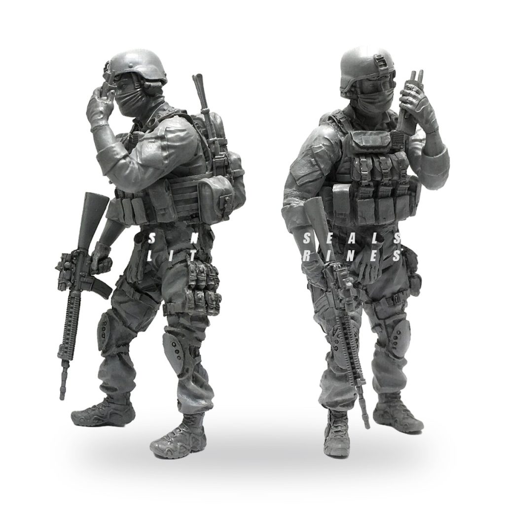 Unpainted US soldier miniature with radio and rifle in tactical gear.