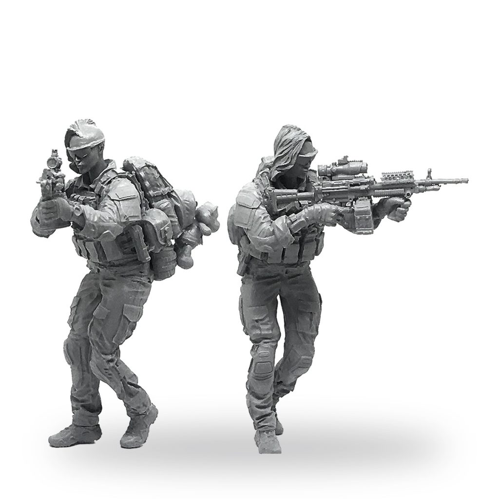 Unpainted female US Navy SEAL miniature in tactical gear holding rifle and pistol.