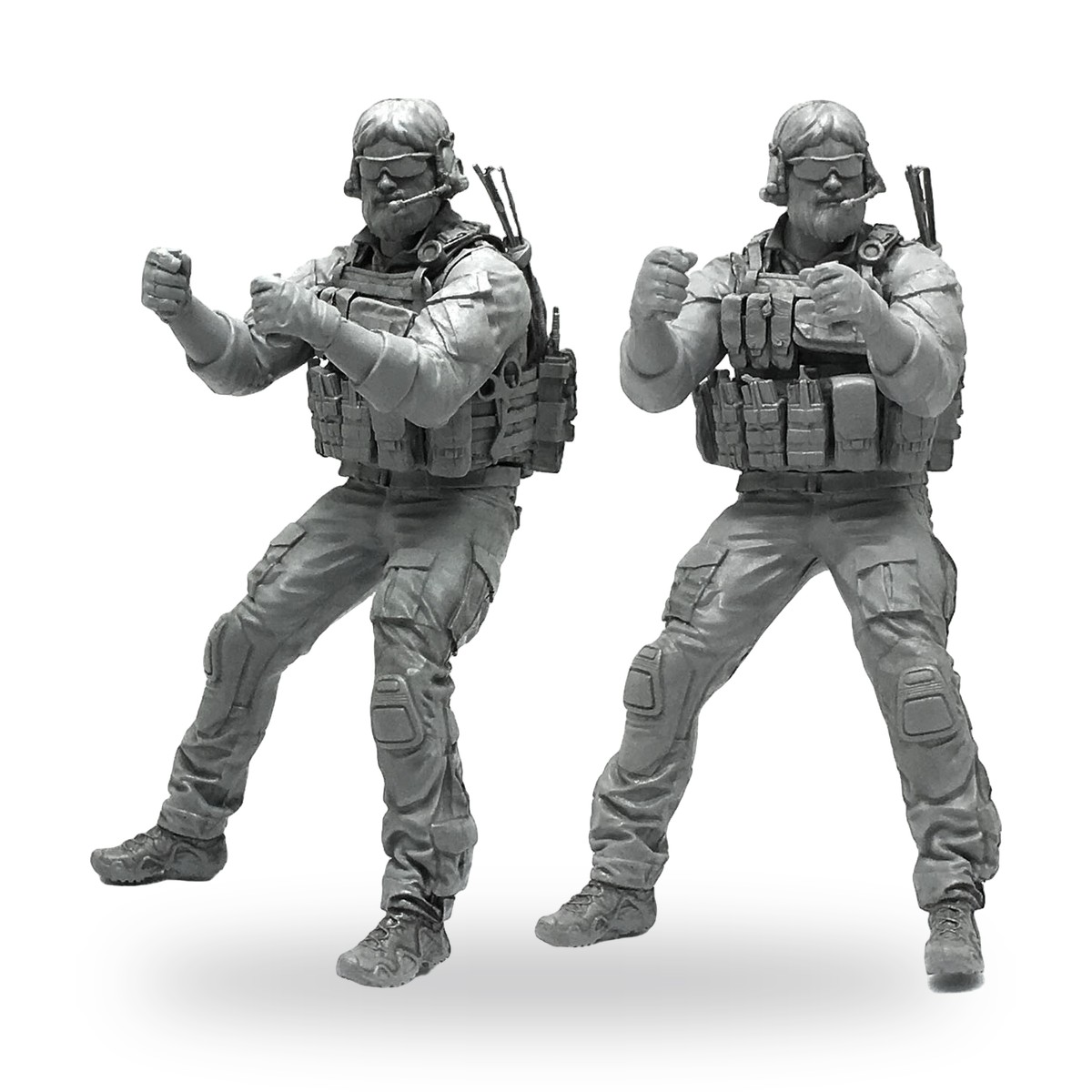 Unpainted modern soldier miniature in tactical gear with backpack and pouches.