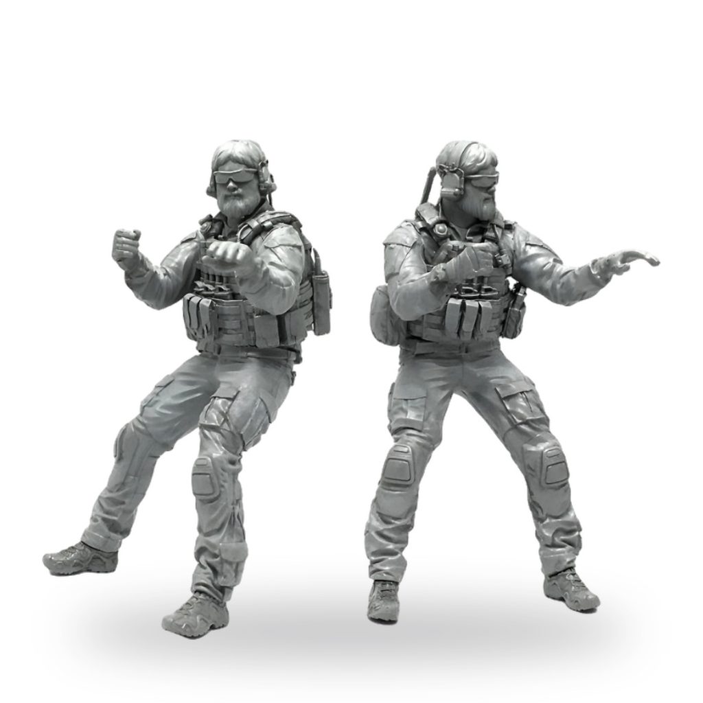 Unpainted 1/35 resin miniature of modern soldier in tactical gear performing dynamic pose.
