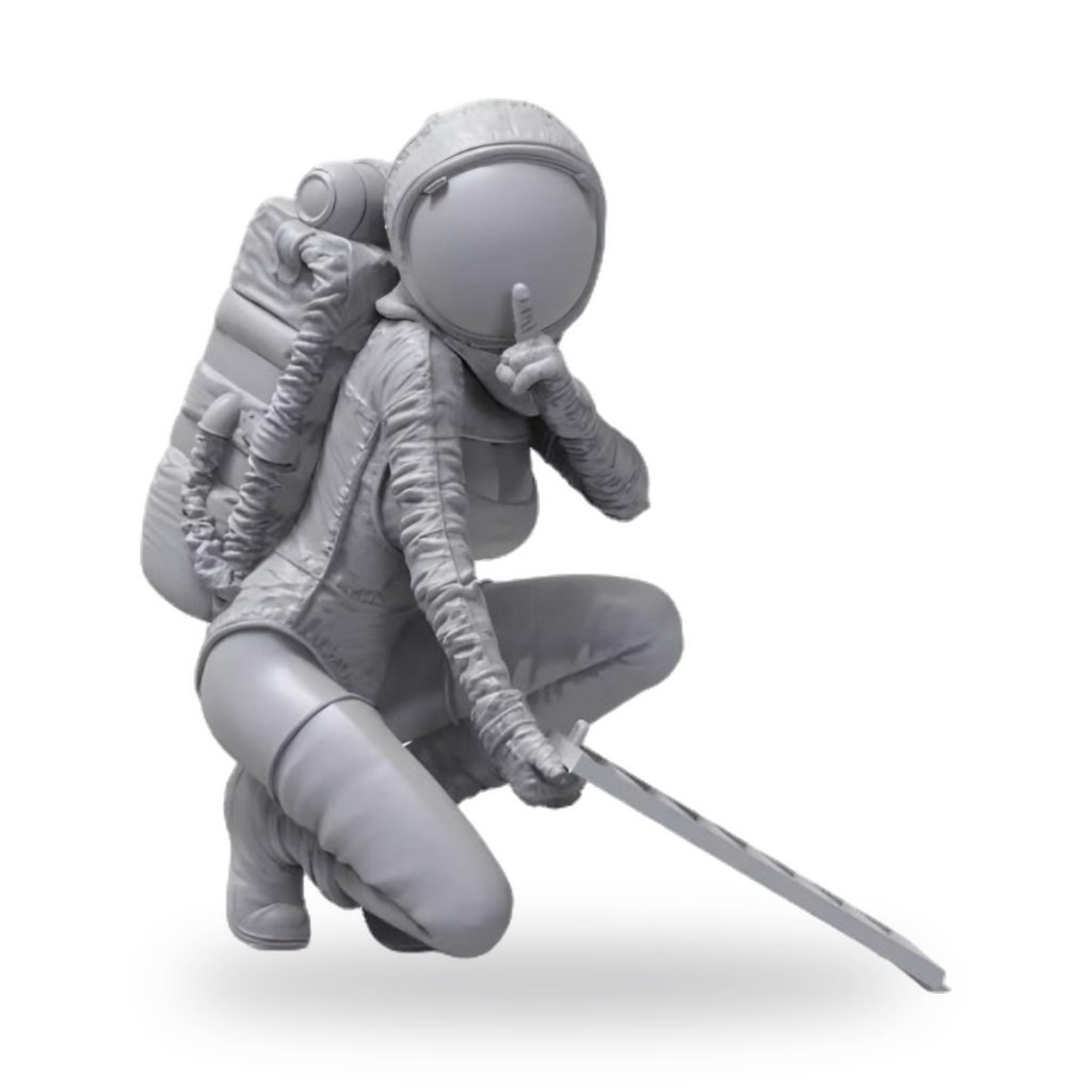 Unpainted astronaut figure in crouching pose holding sword and making shushing gesture.