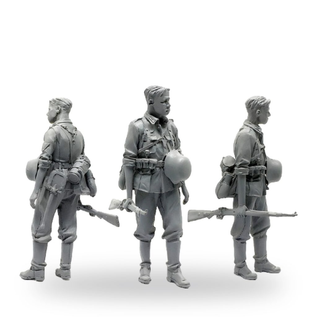Unpainted 1/35 scale standing soldier with rifle and gear from three angles.