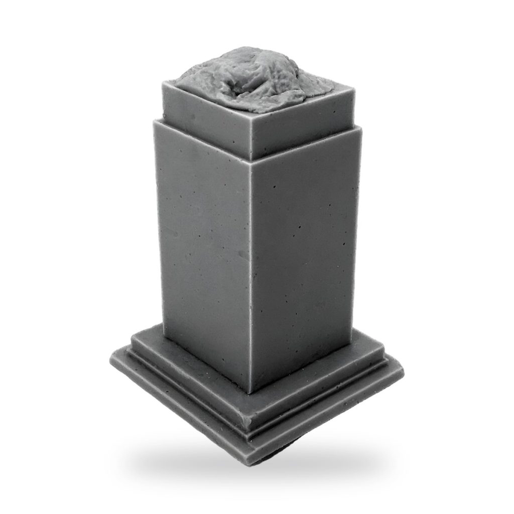 Unpainted gray square pedestal with textured top piece on stepped base.