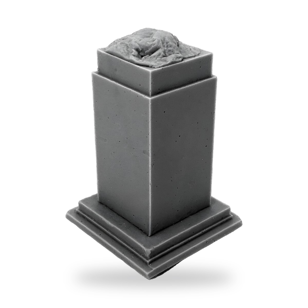 Unpainted gray square pedestal with textured top piece on stepped base.