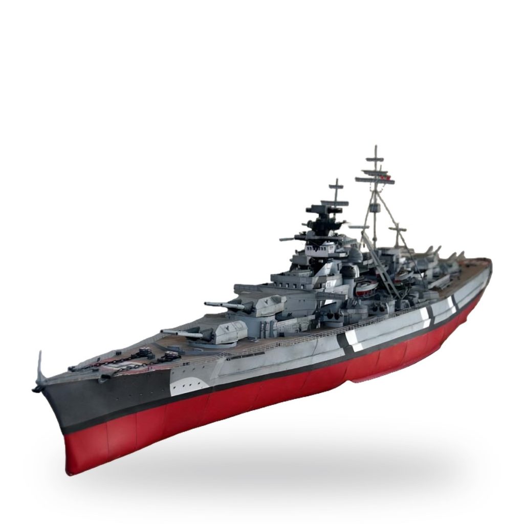 Unpainted WWII German Bismarck battleship 3D paper puzzle model on white background.