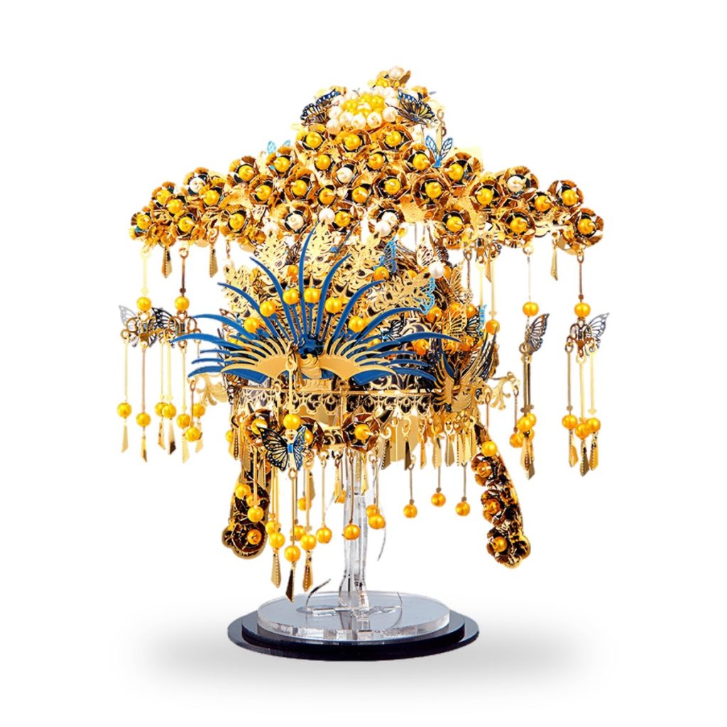 Golden phoenix coronet headpiece with blue feathers and yellow beads on display stand.