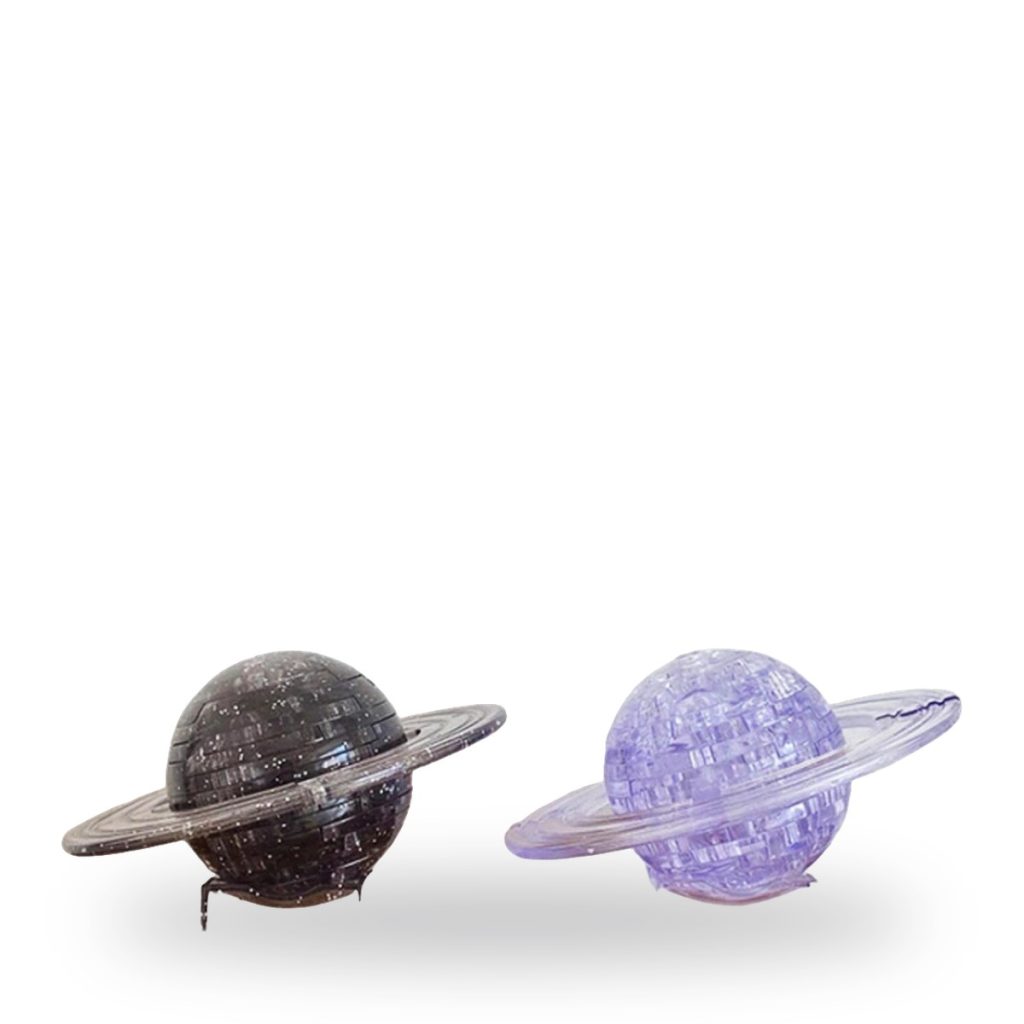 Two glittery plastic Saturn planet models with rings in black and purple colors.