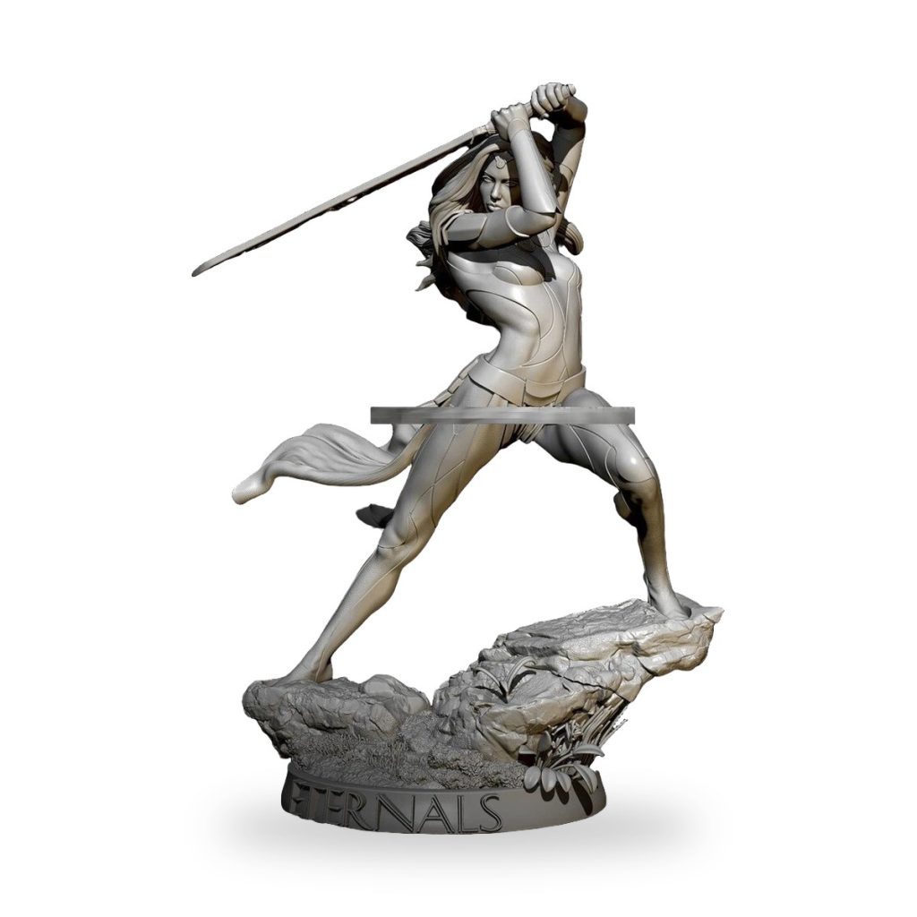Unpainted Sersi figure from Eternals movie in dynamic pose with sword on rocky base.