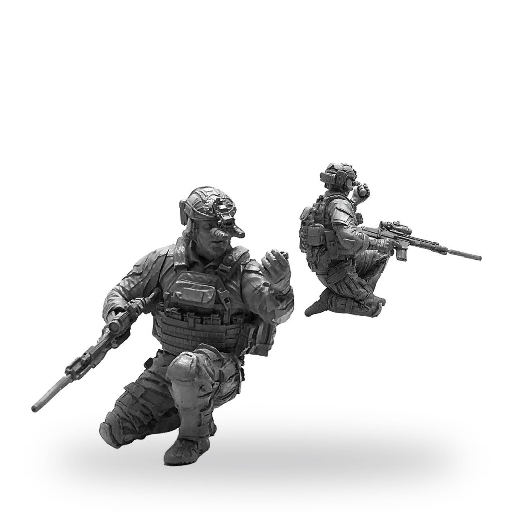 Unpainted US Special Forces soldier figures in tactical gear with rifles.