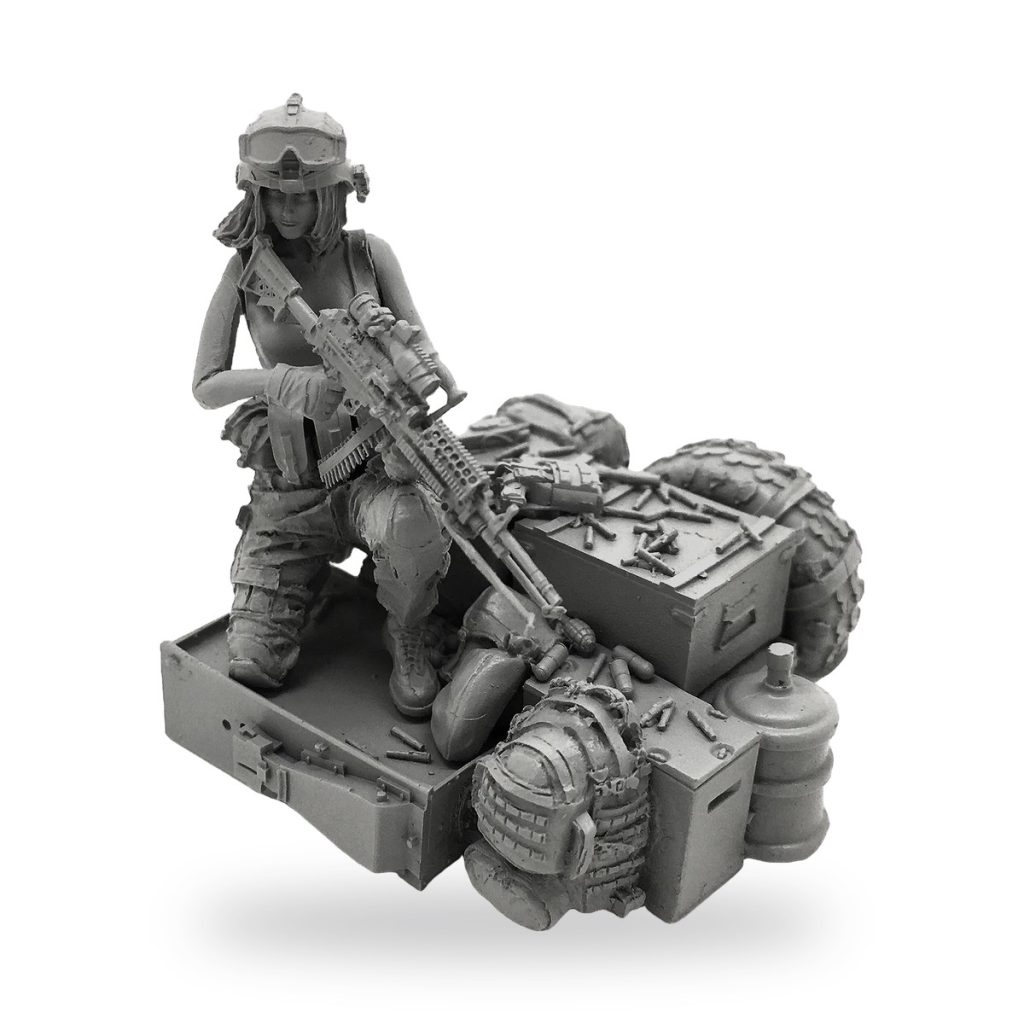 Unpainted female soldier kneeling with assault rifle and gear on base.