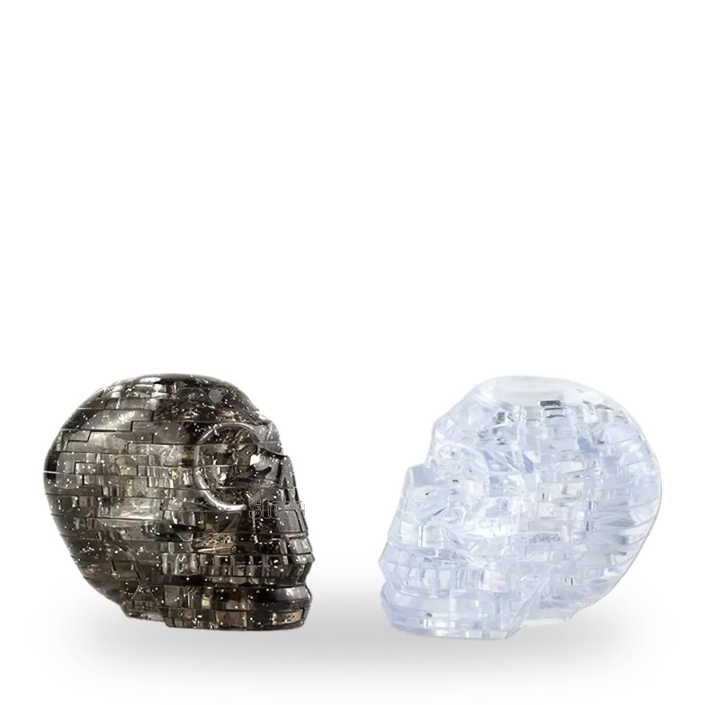 Two glittering crystal skull puzzles in black and clear colors.