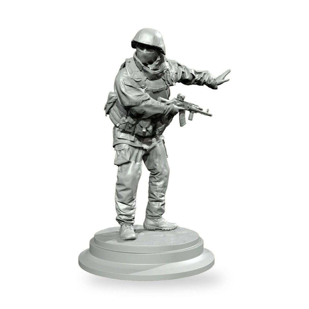 Unpainted Russian soldier in tactical gear holding rifle on circular base.