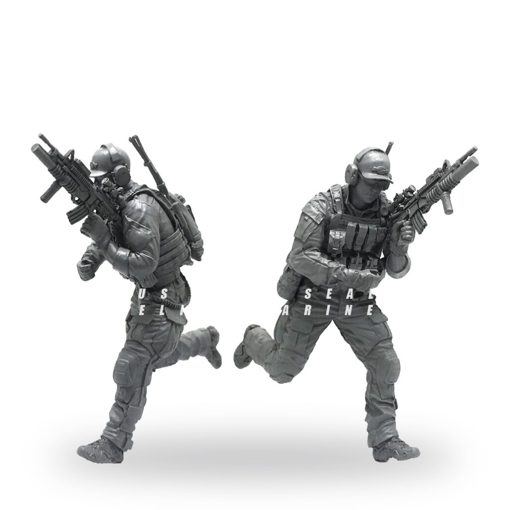 Unpainted US Navy SEAL action figures in tactical gear with rifles.