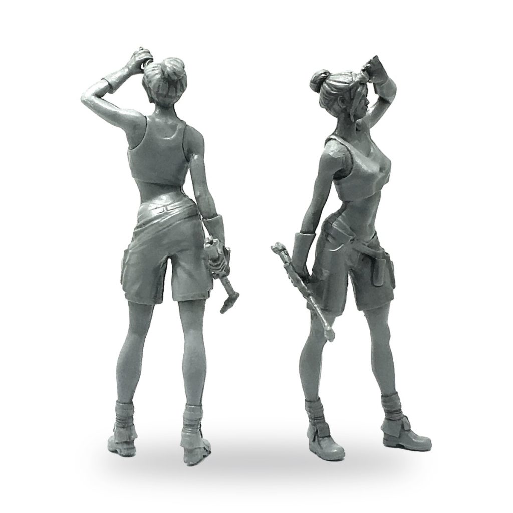 Unpainted female mechanic figure in shorts and tank top holding tools.